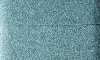 Light blue textured paper background with subtle horizontal fold, minimalist surface for design and mockup use.