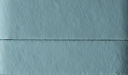 Soft blue paper texture with fine grain and horizontal line, clean abstract background for creative projects.