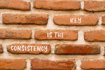 Consistency is the key symbol. Concept words Consistency is the key on beautiful brick wall. Beautiful brick wall background. Business consistency is the key concept. Copy space.