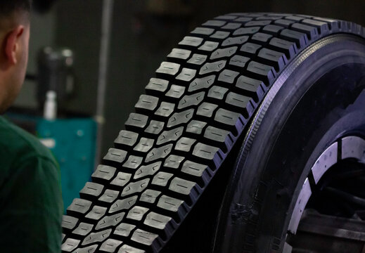 At the tire retreading factory, truck tires with retreaded tread patterns have been given a second life.
