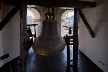 Obraz premium The iconic bells within the belfry of the Convento de Santo Domingo in Lima, a site defined by nearly 500 years of religious and architectural history. 