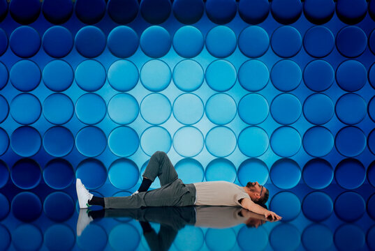 Relaxing man by blue wall 3D structure