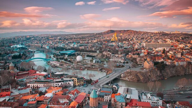 Tbilisi, Georgia. Top View Of Famous Landmarks In spring sunset Evening. Georgian Capital Skyline Cityscape. Justice House, Bridge Of Peace, Concert Hall, Rike Park And Presidential Palace, Metekhi