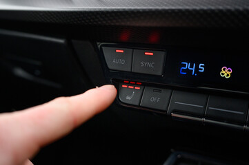 Naklejka premium Car heated seat control button on modern dashboard