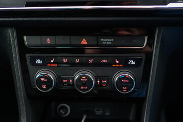 Fototapeta premium Car climate control panel with air conditioning and heated seats