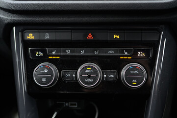 Fototapeta premium Car climate control panel with air conditioning and heated seats