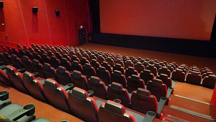 Naklejka premium red movie theater, white screen and seats