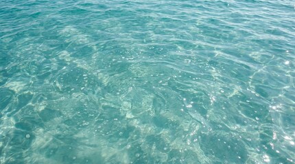 Obraz premium Clear turquoise water texture. Patterns of bubbles. Light dances on water's surface