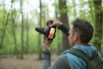 A skilled photographer capturing a stunning shot while surrounded by the vibrant colors of a...