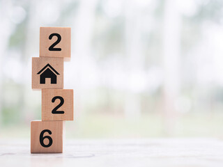 House icons, Wooden blocks with the number 2026. The concept for house, Property investment, House mortgage, Real estate in year 2026