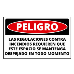 Spanish language danger fire regulations demand that this place be clear at all times sign