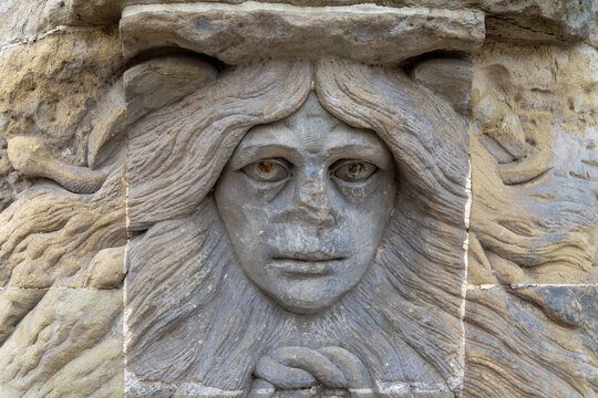 Dessau, Germany. December 23, 2025. A stone mascaron in the shape