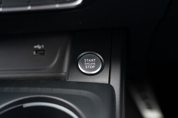 Car ignition start stop button on modern dashboard
