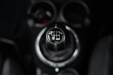 Six speed manual gear stick in car interior