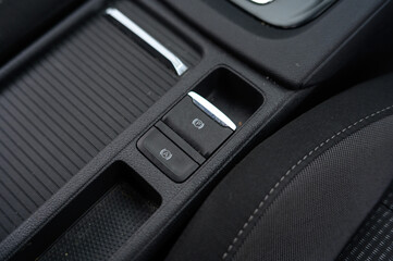 Electronic parking brake button on modern car console