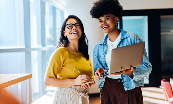 Shaping new ideas: Colleagues refine plans during a quick huddle