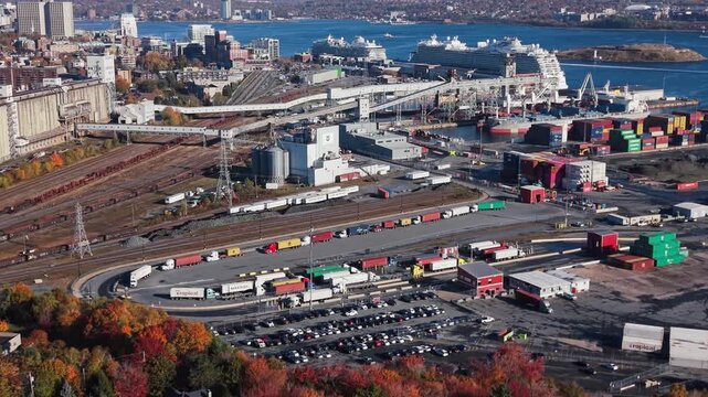 Cinematic Drone Shot Shows Colorful Containers, Towering Cranes, And Long Lines Of Semi Trucks Waiting To Load And Unload Cargo At Canada Key Maritime Trade Hub In Halifax, Nova Scotia.