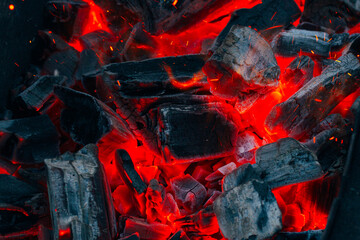 Intense Glowing Embers Closerange View, Vivid Image Of Hot Coals With Flickering Sparks And Smoky Ash