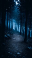 Mysterious Blue Fog Illuminates a Dark Forest Path at Night.