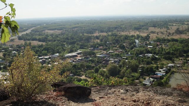 Peaceful panoramic view from Phu Pha Wua Forest Park in Kalasin, Thailand. Natural mountain landscape, lush forest, and serene atmosphere ideal for travel and nature footage.