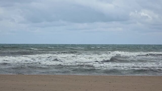 view of Malvarrosa Beach (Platja de la Malva-rosa) is Valencia's most famous urban beach at a cloudy day 