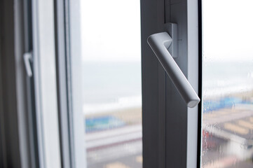 Modern Window Handle with City View Outside