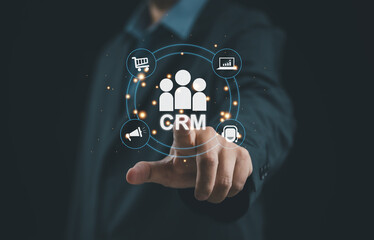 Professional using CRM system to manage customer data, sales, marketing, and support processes. Digital platform improves relationship management, workflow efficiency, analytics, communication, and bu