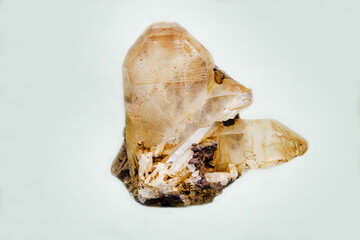 Quartz, Japanese double on a light background. Gems, mineralogy, jewelry.