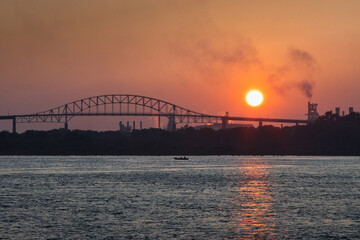 The Sault Ste. Marie International Bridge over St Marys River on the USA/Canada border at sunset