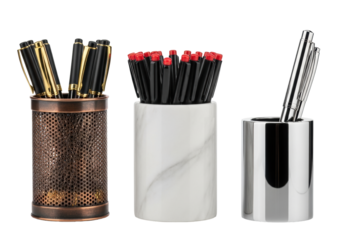 close-up macro of three luxury pen holders (copper, marble, chrome) displaying varied textures and pens, set on a reflective white surface under raking light. aesthetic study in materials and design