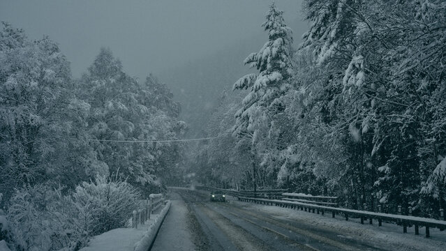 car in winter road in the mountains