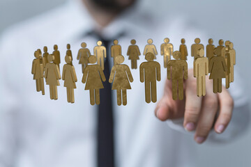 Business team concept. Businessman hand pointing to a group of people forming a circle to represent...