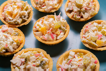 Shrimp and pineapple salad in tartlets on a plate