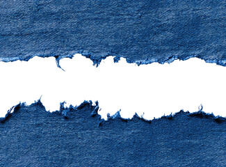 Ripped denim fabric with a black hole