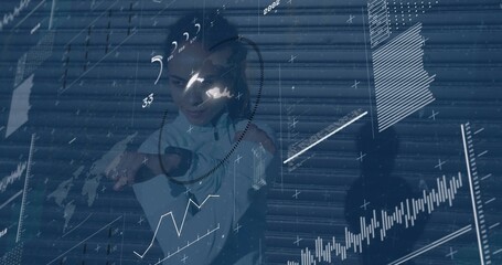 Pointing woman engaging with HUD overlays before roller shutter, with visor headset zip jacket