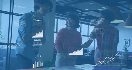 Discussing three coworkers in casual workwear reviewing charts at modern office, with data overlays