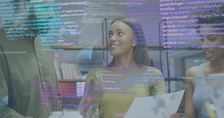 Discussing center woman in yellow sweater holding dot-map document at office, with code overlay