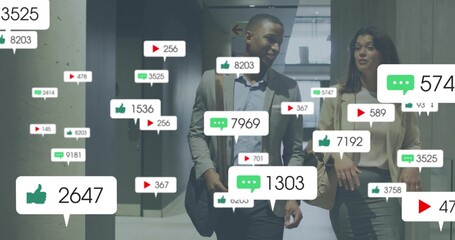 Walking professionals in blazers talking in office corridor with satchel, handbag and social icons