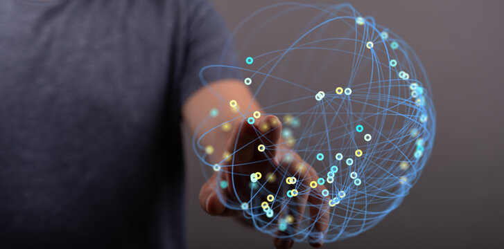 Close up of person touching illuminated digital sphere representing global connection and networking. Ideal for technology or communication them - Powered by Adobe