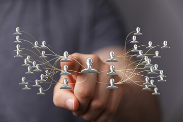 Hand reaching towards a network concept representing teamwork and relationships, digital or business connections.