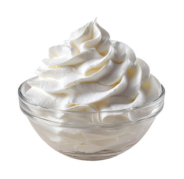 Whipped cream in a small glass bowl.  Fluffy, thick, white dairy topping