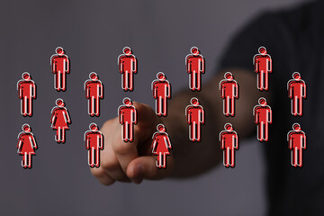 Hand pointing at person icons representing community, network, social media, connection, teamwork, people, and