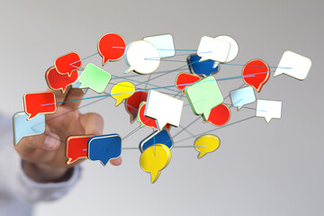 Conceptual image of a hand interacting with digital speech bubbles, representing online...