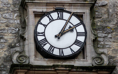 Close-up view of the clock face of the Carfax Tower, a historic landmark in Oxford, which is all that remains of the former St. Martin's Church. 