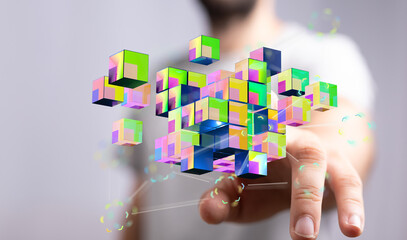 Abstract image of a hand interacting with a 3D cube structure. Modern technology and digital concept illustrati