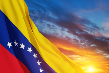 Naklejka premium Venezuela flag on background of sunset sky. Patriotic concept. Banner with place for text.