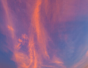 A radiant sunset paints the horizon in vivid tones of gold and purple. The still lake mirrors every color with perfect clarity, creating a dreamy balance of light, water, and silence at sunset.