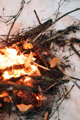 Roasting lard over a fire in winter