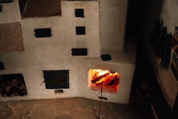 A cozy fireplace with a roaring fire