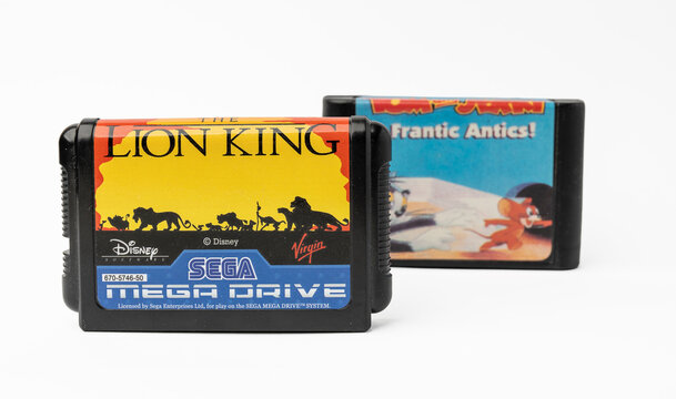 Old Sega Mega Drive console games on cartridge isolated on a white background. Vintage gaming concept.
